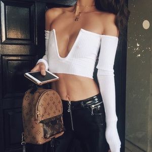 Old areyouami top that is no longer sold :) XS.